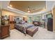 Bright main bedroom with carpet, sitting area, and stylish ceiling fan at 405 Deer Brush Ln, Waxhaw, NC 28173