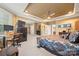Bright main bedroom with carpet, desk, and tray ceiling at 405 Deer Brush Ln, Waxhaw, NC 28173