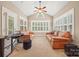 Cozy sunroom with natural lighting and comfortable seating arrangement perfect for relaxation at 405 Deer Brush Ln, Waxhaw, NC 28173
