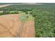 Property with house, outbuildings, fields, and a long driveway, set within a serene rural landscape at 4115 Jenkins Rd, Marshville, NC 28103