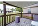 View of outdoor space with ceiling and railing, plus yard with play equipment at 4115 Jenkins Rd, Marshville, NC 28103