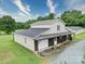 Spacious barn featuring a garage and covered porch perfect for storage or workshop at 4115 Jenkins Rd, Marshville, NC 28103