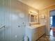 Bathroom featuring double sinks, tile backsplash, and contemporary lighting, offering a clean and modern design at 4115 Jenkins Rd, Marshville, NC 28103