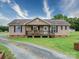 Inviting single-story home with a cozy front porch, perfect for relaxing outdoors at 4115 Jenkins Rd, Marshville, NC 28103