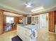 Charming kitchen featuring white cabinets, marble countertops, and an open view into the dining area at 4115 Jenkins Rd, Marshville, NC 28103