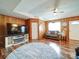 Inviting living room with a fireplace, a cozy sofa, and a large TV, perfect for relaxation at 4115 Jenkins Rd, Marshville, NC 28103