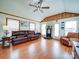 Cozy living room with a leather sofa, fireplace, and wood-look flooring offering a warm ambiance at 4115 Jenkins Rd, Marshville, NC 28103