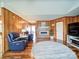Inviting living room boasting wood paneling, a modern fireplace, and comfortable seating area at 4115 Jenkins Rd, Marshville, NC 28103