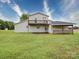 Rear view of a building showcasing a balcony and covered patio, offering outdoor entertainment options at 4115 Jenkins Rd, Marshville, NC 28103