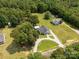 Aerial view of a house with long driveway with several outbuildings and wooded surroundings at 4285 Palmer Lloyd Rd, Lancaster, SC 29720