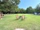 Spacious backyard with well-maintained lawn, mature trees, and seating area with chairs at 4285 Palmer Lloyd Rd, Lancaster, SC 29720