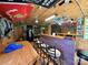 Shot of the custom bar featuring brick accent wall, wood counter and decor at 4285 Palmer Lloyd Rd, Lancaster, SC 29720