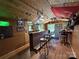 Inside custom bar offering wood flooring, exposed ceiling, decorations, and brick accents at 4285 Palmer Lloyd Rd, Lancaster, SC 29720