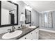 Bathroom featuring double sinks, neutral paint, modern fixtures, white cabinets and tile backsplash at 4285 Palmer Lloyd Rd, Lancaster, SC 29720