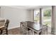 Bright dining area featuring a classic table set and natural light from large windows, perfect for Gathering meals at 4285 Palmer Lloyd Rd, Lancaster, SC 29720