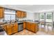 Functional kitchen area with wooden cabinetry, durable countertops, and an adjacent dining space for easy meals at 4285 Palmer Lloyd Rd, Lancaster, SC 29720
