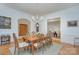 Another view of the dining room featuring hardwood floors, a wooden table, and seating for eight at 4323 Rosecliff Dr, Charlotte, NC 28277
