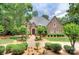 Stately brick home with mature landscaping, a meticulously maintained yard, and traditional architecture at 4323 Rosecliff Dr, Charlotte, NC 28277