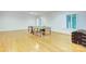 Bright game room with hardwood floors, natural light, and a ping pong table at 4323 Rosecliff Dr, Charlotte, NC 28277