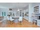 Bright and modern kitchen featuring white cabinets, hardwood floors, a kitchen island, and stainless steel appliances at 4323 Rosecliff Dr, Charlotte, NC 28277