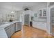 Modern kitchen featuring stainless steel appliances, a wine cooler, light countertops and hardwood flooring at 4323 Rosecliff Dr, Charlotte, NC 28277