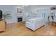 Inviting living room with a fireplace, hardwood floors, and an open layout, perfect for entertaining at 4323 Rosecliff Dr, Charlotte, NC 28277