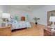 Bright main bedroom with hardwood floors, windows with shutters, and a ceiling fan at 4323 Rosecliff Dr, Charlotte, NC 28277