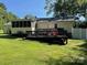 The backyard features a spacious wooden deck, a screened in porch, and a well maintained lawn at 4337 Gelinda Ct, Gastonia, NC 28056