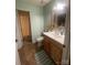 Cozy bathroom with updated vanity, and tiled floors leading to the shower at 4337 Gelinda Ct, Gastonia, NC 28056