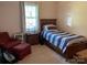 Bright bedroom with window and wood furnishings at 4337 Gelinda Ct, Gastonia, NC 28056