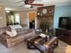 Cozy living room with a brick fireplace, ceiling fan, and comfortable furnishings at 4337 Gelinda Ct, Gastonia, NC 28056