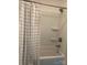 Clean shower with white subway tiles and a gray shower curtain at 4337 Gelinda Ct, Gastonia, NC 28056