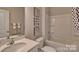 Clean and functional bathroom with modern fixtures, ample storage, and a combination tub/shower at 4607 Harris Elliot Rd, Lincolnton, NC 28092