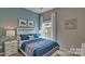 Inviting bedroom featuring a cozy bed, soft lighting, and a calming color scheme at 4607 Harris Elliot Rd, Lincolnton, NC 28092