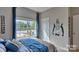Comfortable bedroom showcasing natural light, themed decor, and a relaxing atmosphere at 4607 Harris Elliot Rd, Lincolnton, NC 28092