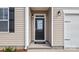 Close up of the home's entry door with stylish accents and a modern design at 4607 Harris Elliot Rd, Lincolnton, NC 28092