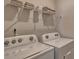 Functional laundry area featuring modern appliances, storage shelves, and efficient design at 4607 Harris Elliot Rd, Lincolnton, NC 28092