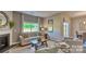 Cozy living room featuring a fireplace, large window, and comfortable seating at 4607 Harris Elliot Rd, Lincolnton, NC 28092