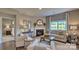 Living room featuring a fireplace, large window, and comfortable seating at 4607 Harris Elliot Rd, Lincolnton, NC 28092