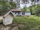 Backyard of property with mature trees, foliage, a small shed and weathered home at 528 Waring Ct # Lot 3, Fort Mill, SC 29707
