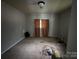 Interior of a bedroom featuring stained carpeting, showing signs of damage and in need of renovation at 528 Waring Ct # Lot 3, Fort Mill, SC 29707
