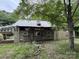 Exterior view of the dilapidated property with a toy car on the roof at 528 Waring Ct # Lot 3, Fort Mill, SC 29707