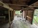 Raw interior space displaying exposed framing, damaged floors, and natural light for a unique renovation project at 528 Waring Ct # Lot 3, Fort Mill, SC 29707