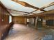 Rustic living room featuring wood-paneled walls, beamed ceilings, and a stone fireplace at 528 Waring Ct # Lot 3, Fort Mill, SC 29707