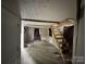 Interior shot of unfinished room and wooden staircase, showing potential for renovation at 528 Waring Ct # Lot 3, Fort Mill, SC 29707