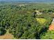 Aerial view shows property lines encompassing wooded acreage, with home situated inside at 5323 Flat Creek Rd, Heath Springs, SC 29058