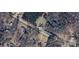 Aerial view of property boundaries and surrounding wooded landscape at 5323 Flat Creek Rd, Heath Springs, SC 29058