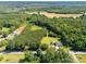 Overhead shot of a home on large, wooded lot, surrounded by lush greenery and trees at 5323 Flat Creek Rd, Heath Springs, SC 29058