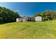 This property offers an expansive backyard, complete with lush green grass and two large storage sheds at 5323 Flat Creek Rd, Heath Springs, SC 29058