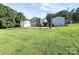 Exterior view of backyard with sheds, patio, and lovely landscaping at 5323 Flat Creek Rd, Heath Springs, SC 29058